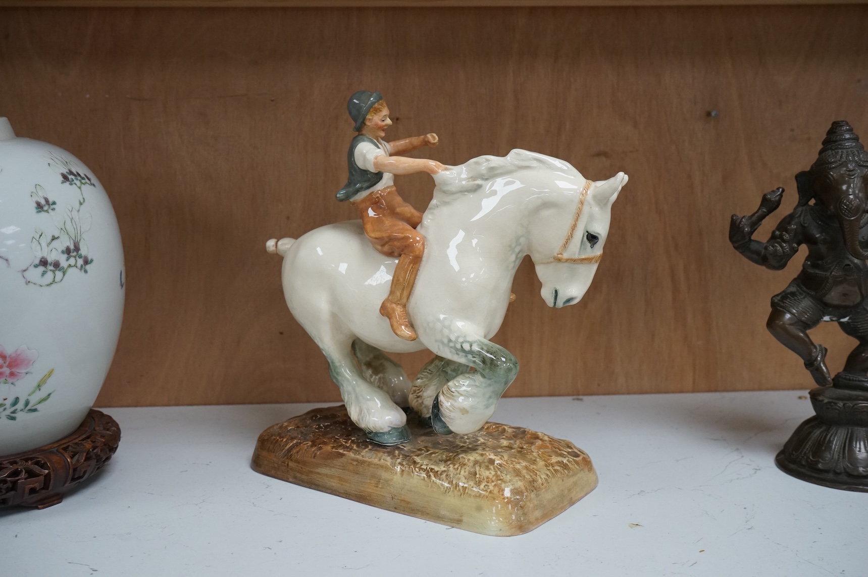 A Royal Doulton figure, ‘The Farmer's Boy’, HN 2520, 24cm wide.